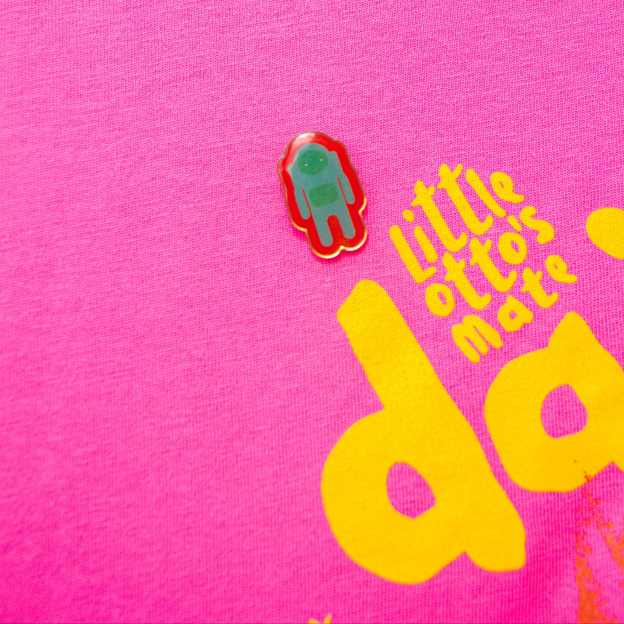 Little Otto's Staff holding Astronaut - pin on pink tshirt 