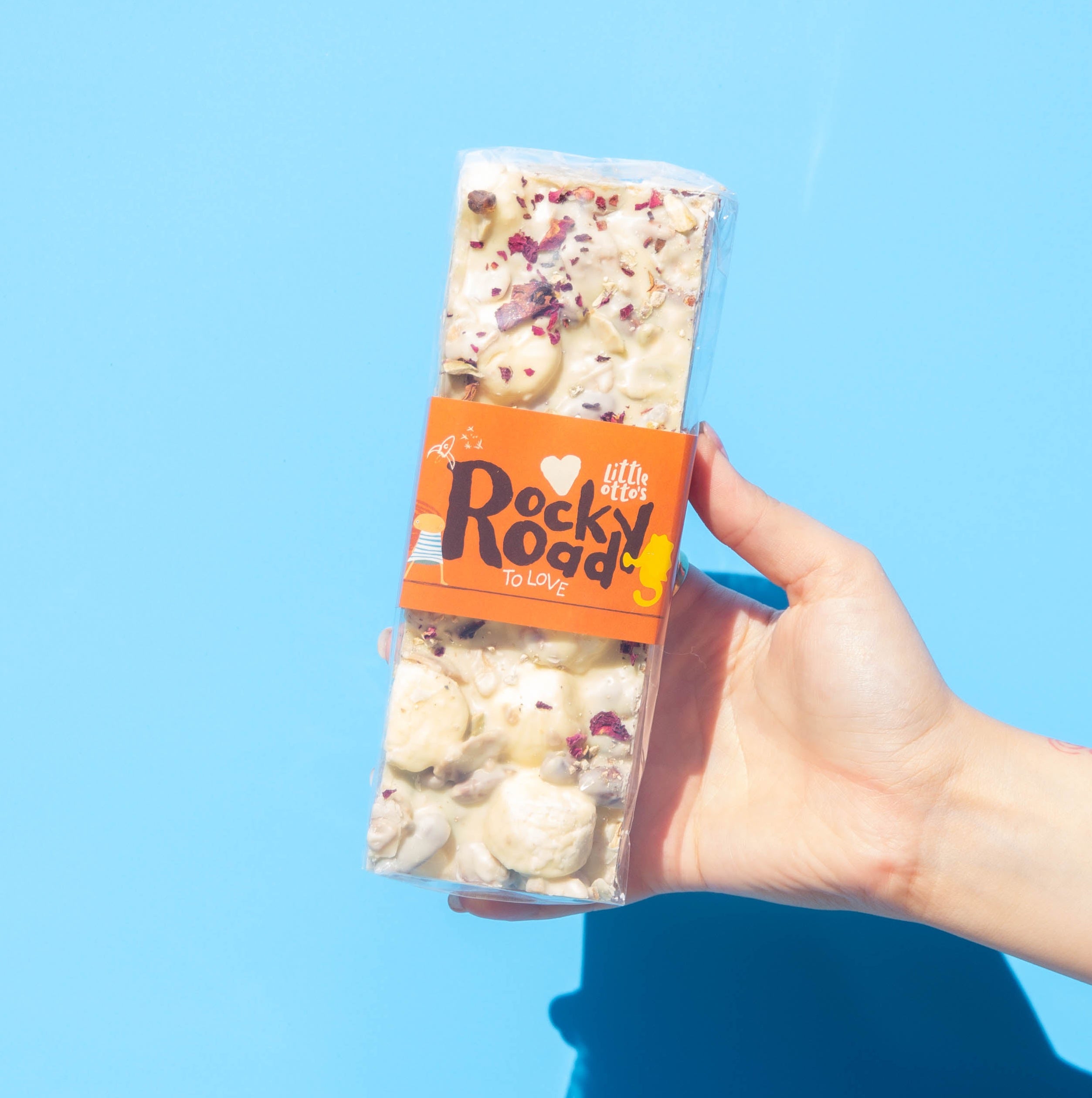 Little Otto's Staff holding rocky road to love 500 infront of Busselton blue wall