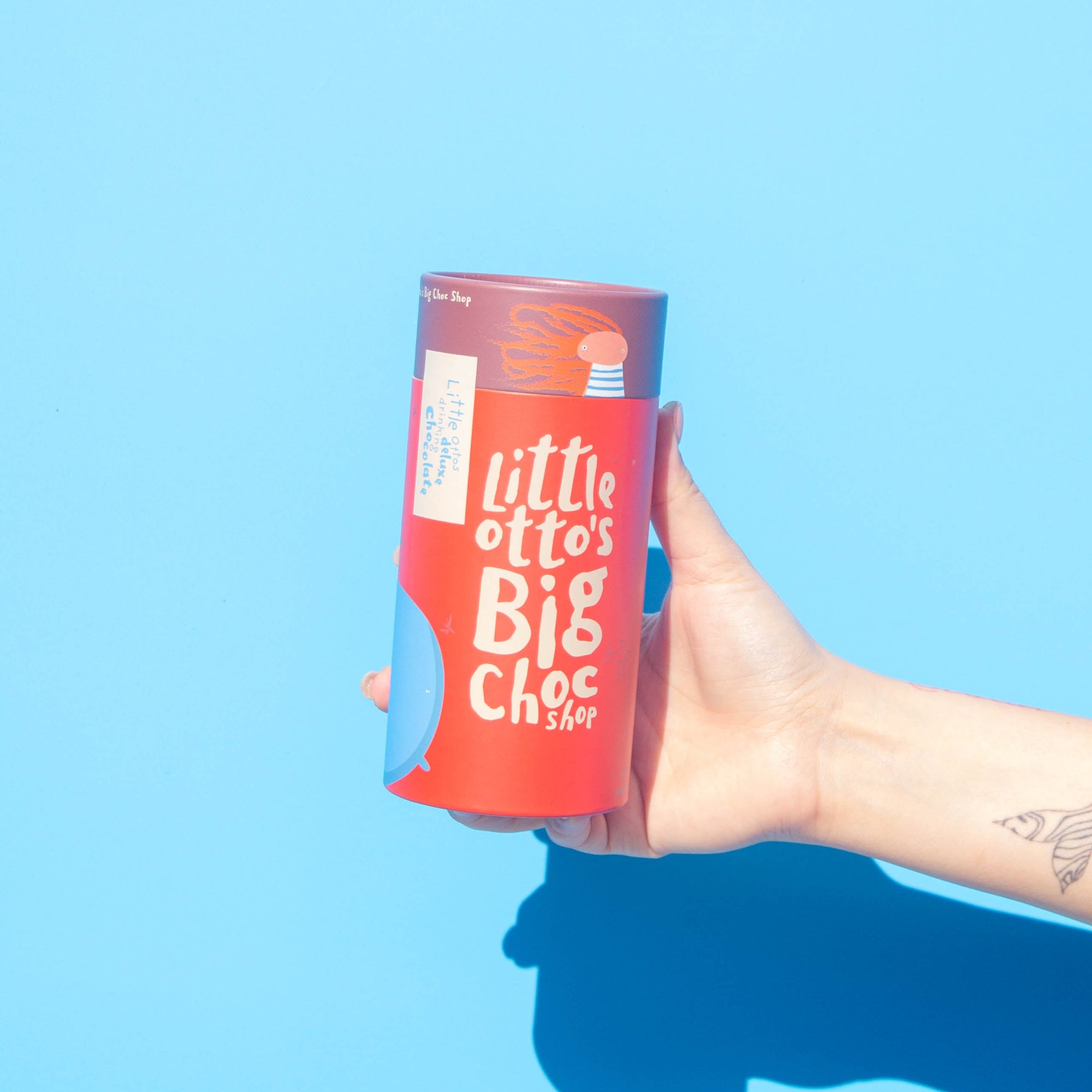 Little Otto's Staff holding Deluxe Drinking Chocolate 500g 